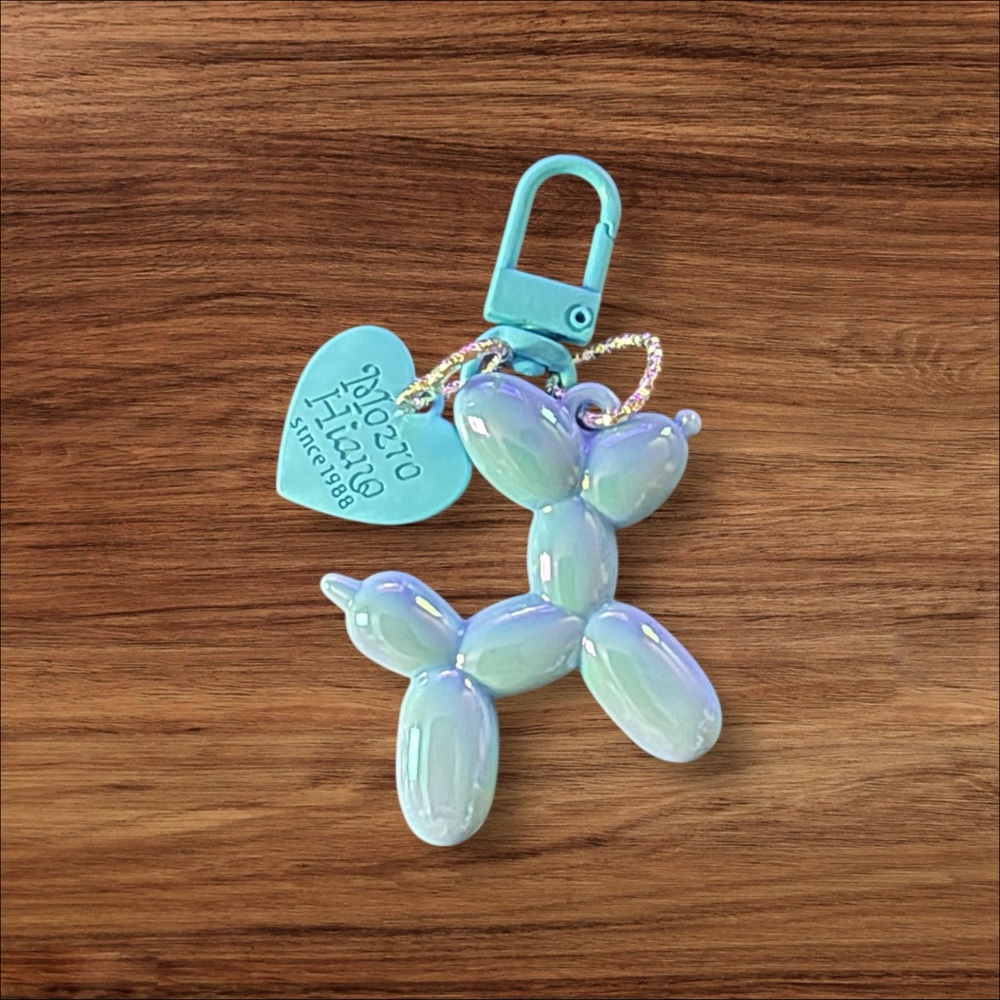 Bright Blue Balloon Dog Keychain with Heart Charm.